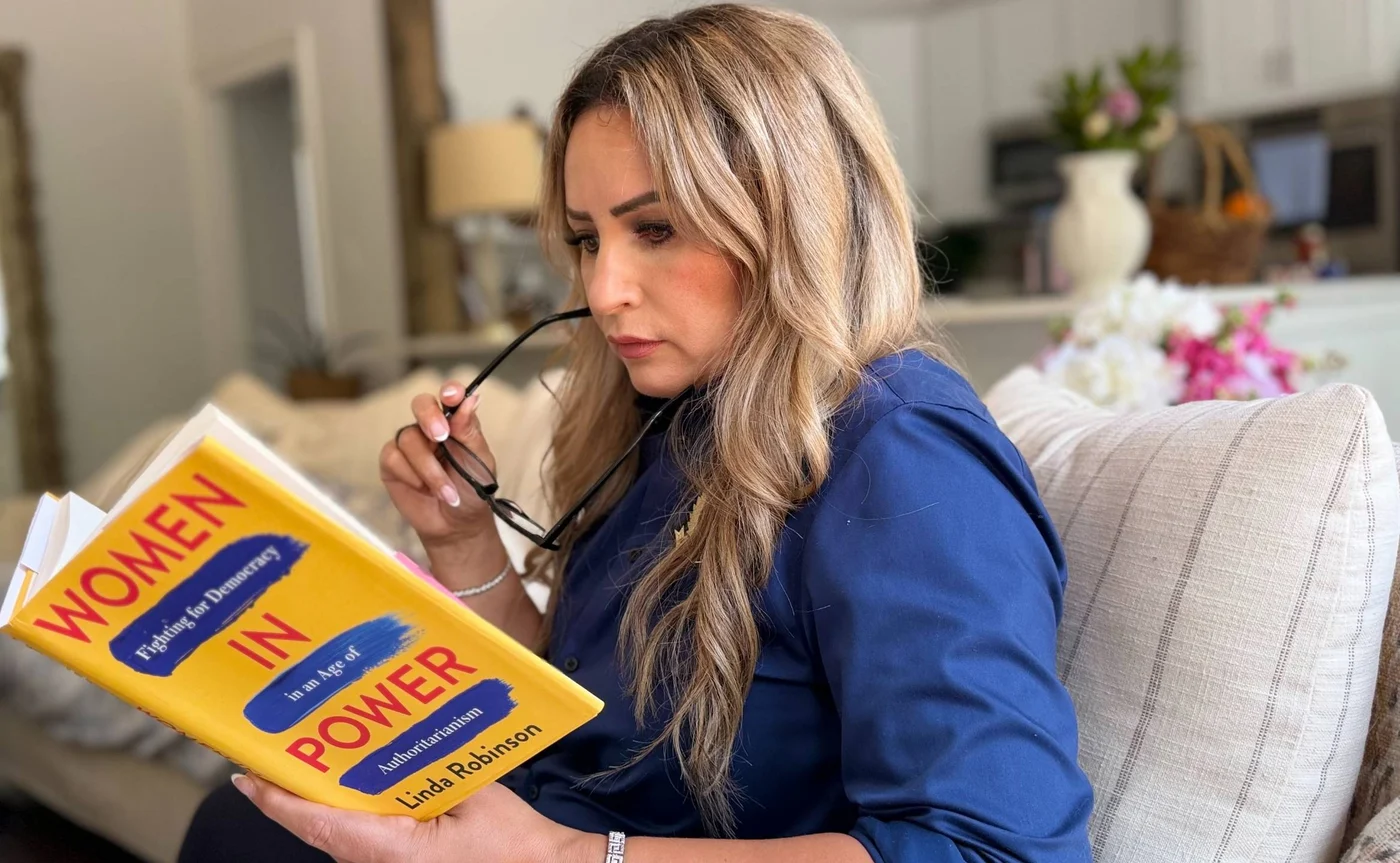 Amy reading Women in Power